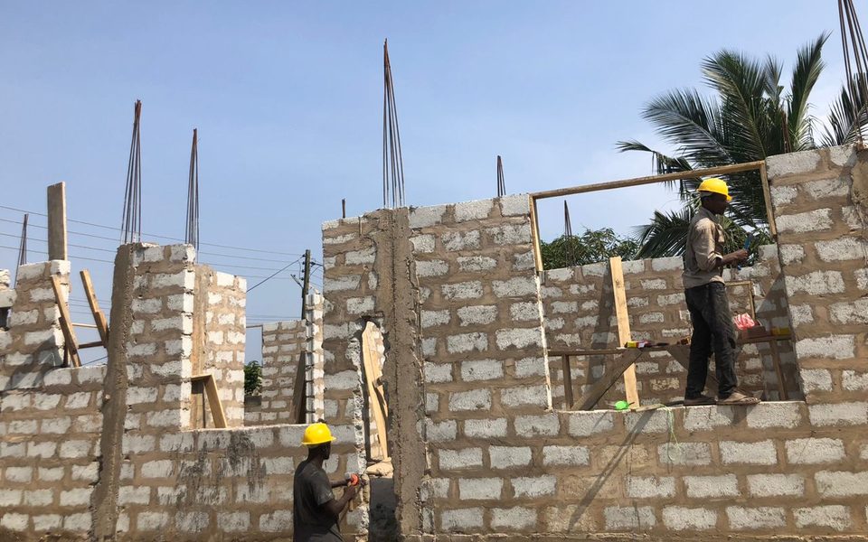 Block walls with reinforcement bars rising from the columns