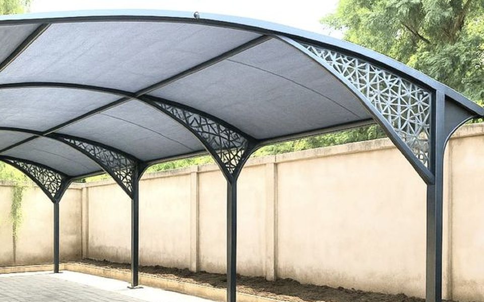 Curved steel carport canopy with laser-cut bracket details