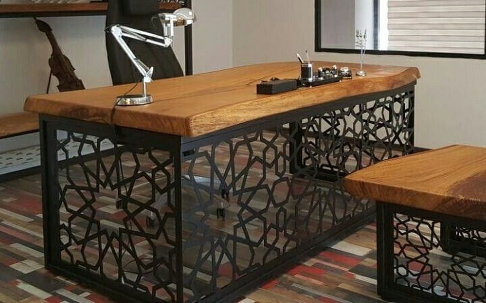 Executive wooden desk on a black laser-cut steel base