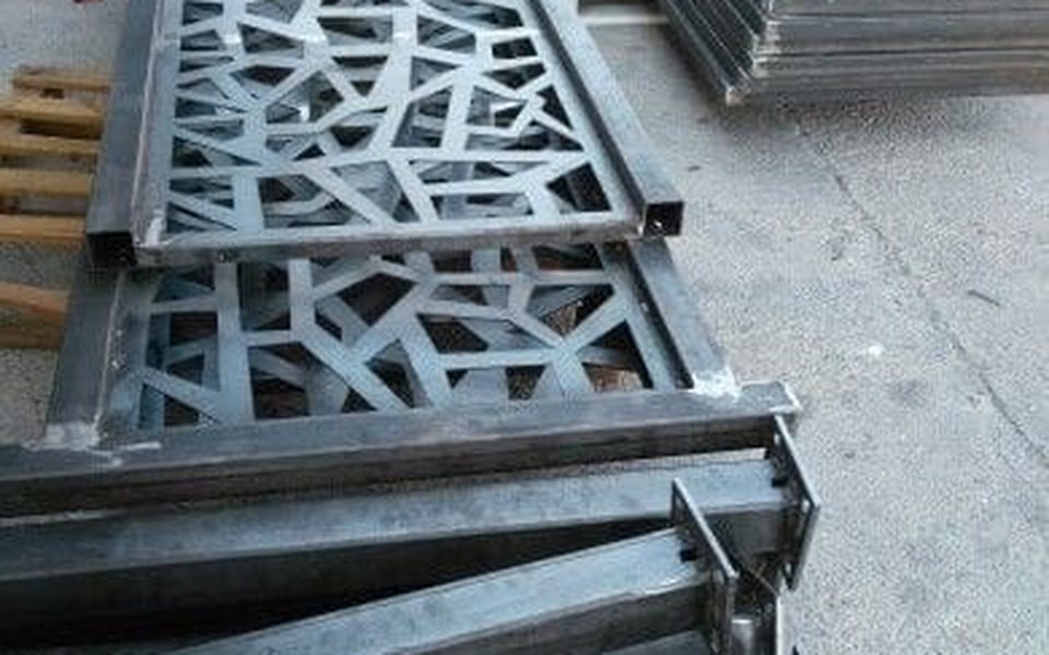 Laser-cut steel fence panels with square tube frames and posts