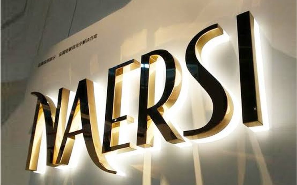 Polished gold and black 3D letters with halo backlighting